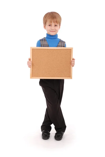 Boy holding a board made of cork — Stock Photo, Image