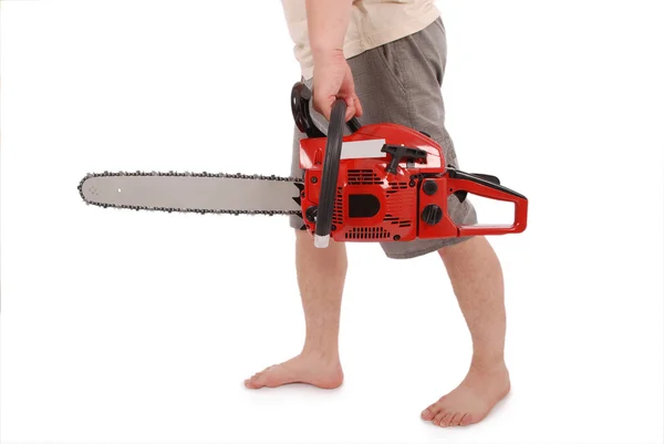 By one hand holding a chainsaw — Stock Photo, Image