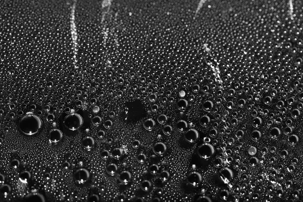 Drops of water macro on a black background — Stock Photo, Image