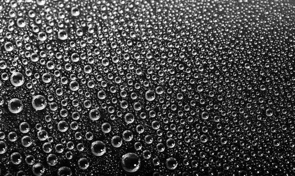 Gotas de agua sobre fondo negro —  Fotos de Stock