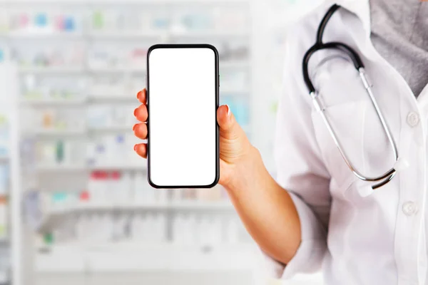 woman doctor showing blank screen of mobile phone. online doctor's consultation