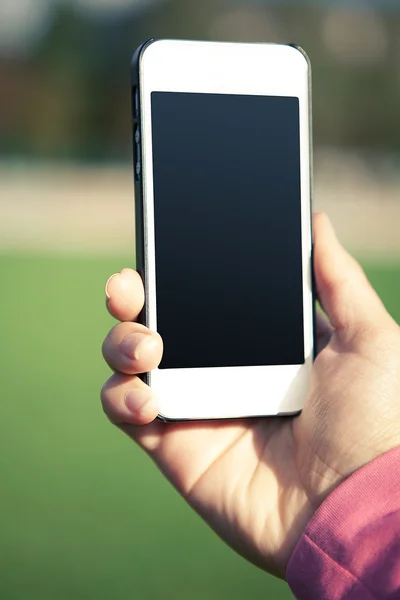 Teléfono en mano — Foto de Stock