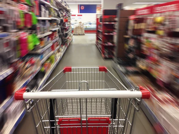 Shopping in supermarket. Shoping cart — Stock Photo, Image