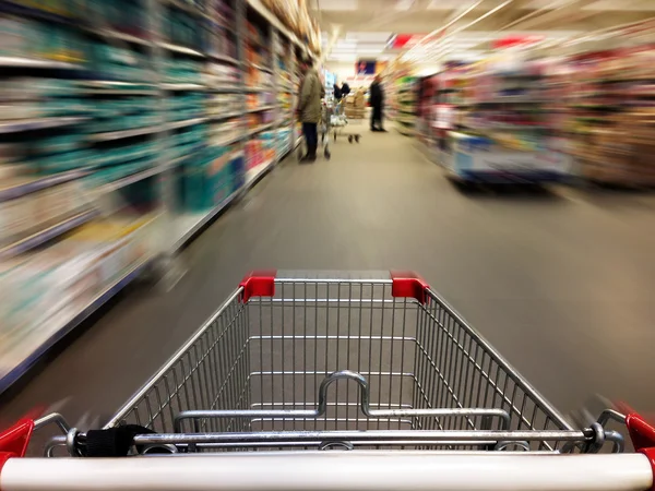 Shopping in supermarket. Shoping cart Stock Photo