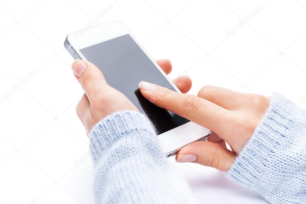 Hand holding White Smartphone with blank screen on white backgro