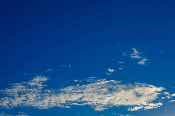 Blue sky with white and grey clouds — Stock Photo, Image