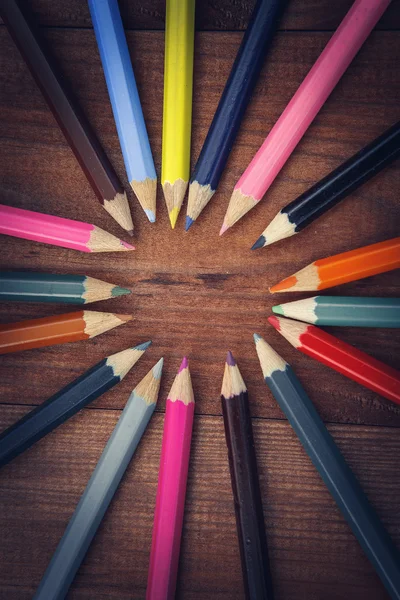 Multicolored pencils on the brown wooden table background — Stock Photo, Image