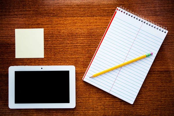 Notebook isolated on a wooden background — Stock Photo, Image