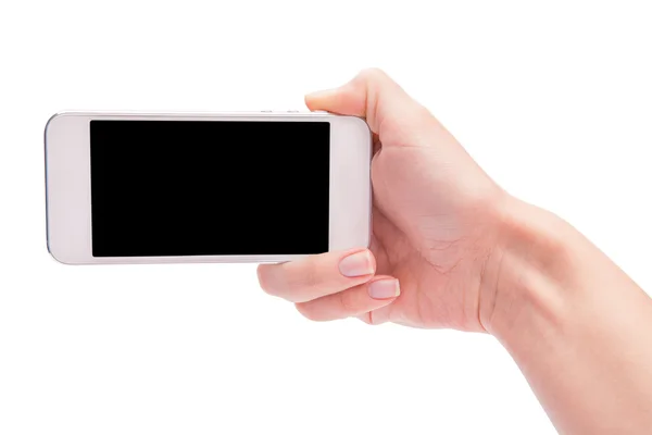 Ruka držící bílý Smartphone s prázdnou obrazovkou na bílé backgro — Stock fotografie