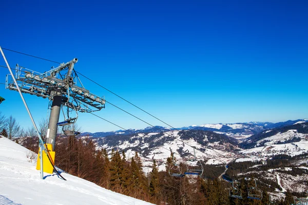 Chairs on chairlift ropeway — Stock Photo, Image