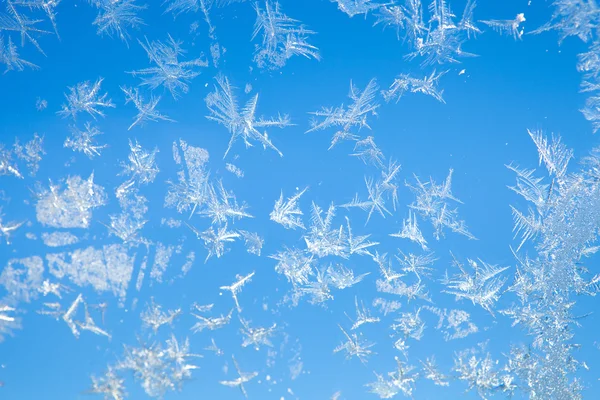 Sfondo invernale da fiocchi di neve sfocatura — Foto Stock