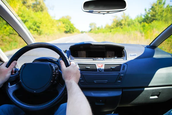 Blurred road and car — Stock Photo, Image