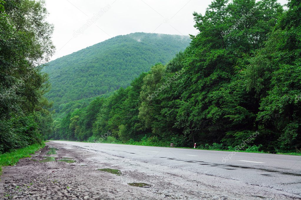 mountain road in rainy day