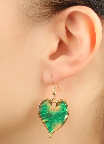 Women's ear with earring — Stock Photo, Image