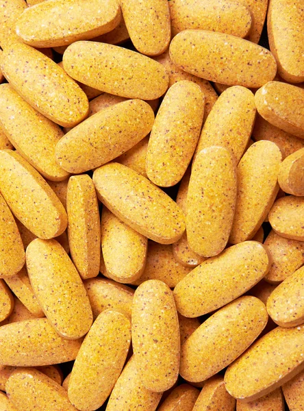 Yellow pills closeup — Stock Photo, Image