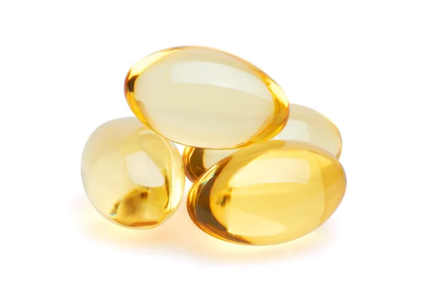 Yellow pills on white — Stock Photo, Image