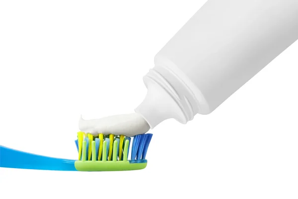 Tandenborstel met tand plakken — Stockfoto