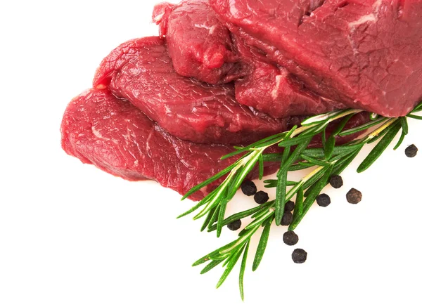 Carne crua fresca com pimenta e alecrim — Fotografia de Stock