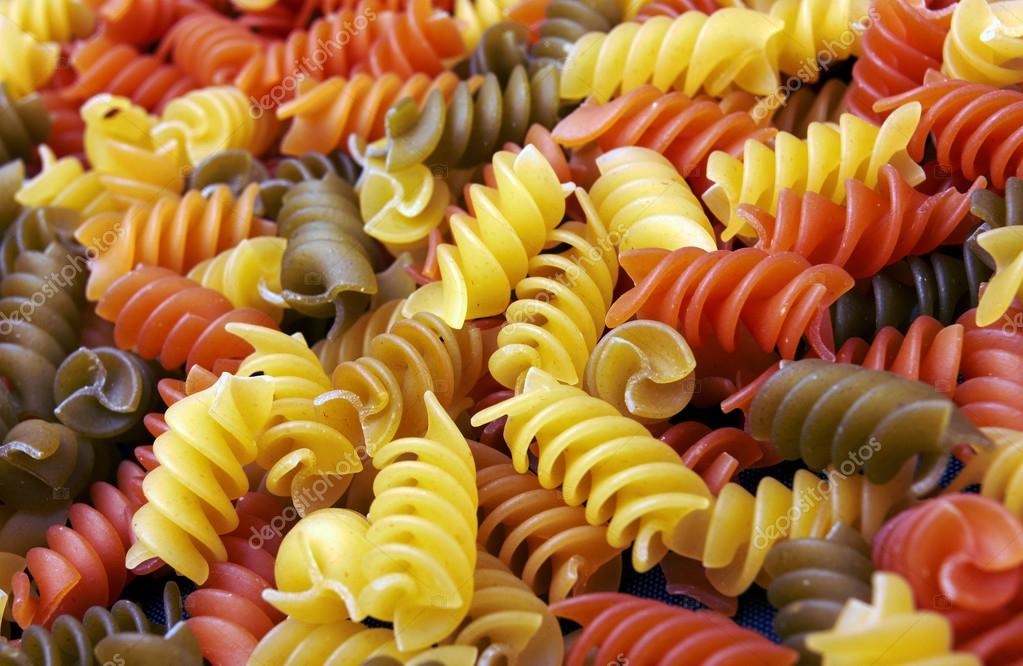 Fusilli italian pasta background Stock Photo by ©krasyuk 73989023