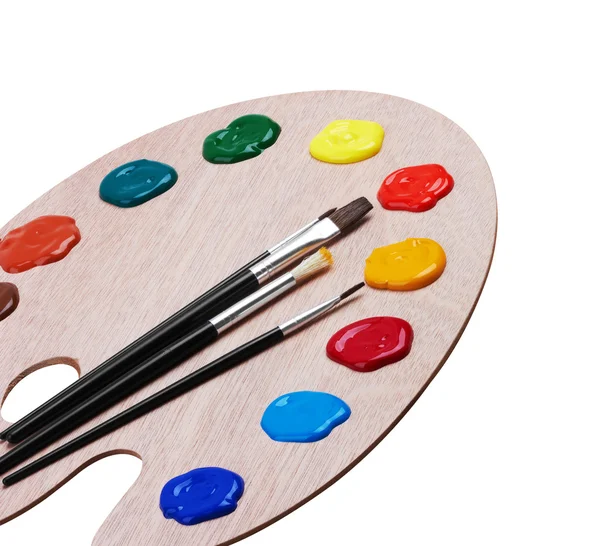 Holzkunstpalette mit Farben und Pinseln — Stockfoto