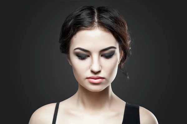 Portrait of beautiful female model on gray background — Stock Photo, Image