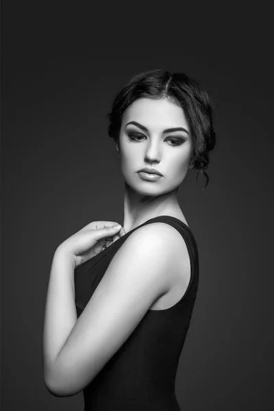 Portrait of beautiful female model on gray background — Stock Photo, Image
