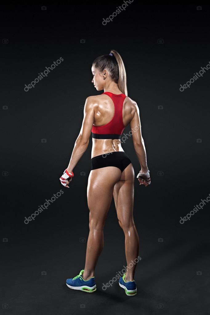 Athletic Young Woman Showing Muscles Of The Back Stock Photo