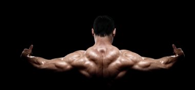 Rear view of healthy muscular young man clipart