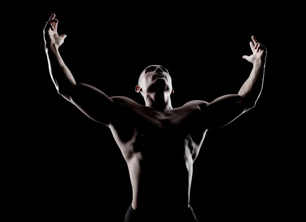 Young handsome sexy bodybuilder looking up — Stock Photo, Image