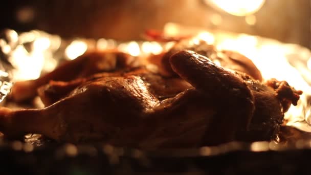 Chicken baked in oven on a foil. — Stock Video