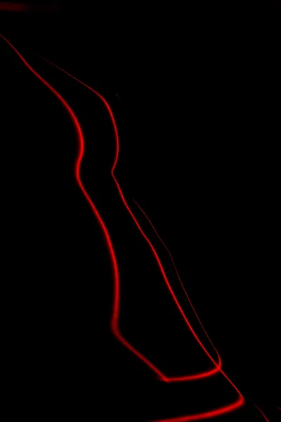 Abstract portrait. Silhouette of Naked woman painted by laser red lines. — Stock Photo, Image