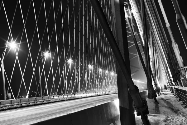 NOVOSIBIRSK, RUSSIA - MARCH 14, 2015: Traffic (motion blur) on modern highway through new Bugrinsky bridge at night, Novosibirsk, Russia — Stock Photo, Image