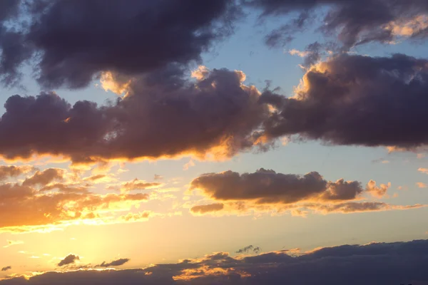 Bright and dark clouds looks like enigmatic figures in sky — Stock Photo, Image