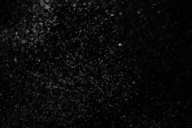 Kar fırtınası doku soyut. Siyah arka plan, ışıkları bokeh vurdu kar taneleri havada uçan