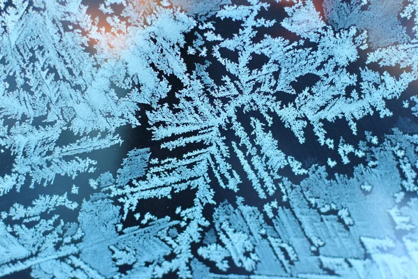 The patterns made by the frost on the  window back (hoarfrost background) — Stok fotoğraf
