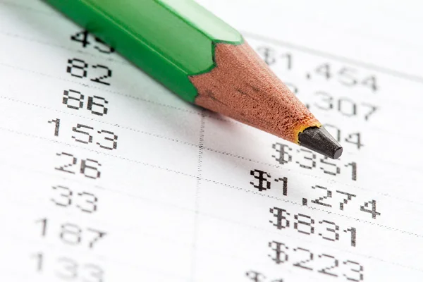 Green pencil and financial chart — Stock Photo, Image