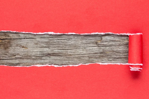 Torn red paper on wooden background — Stock Photo, Image