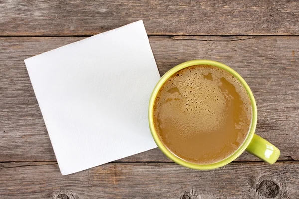 Cup of coffee and blank napkin — Stock Photo, Image
