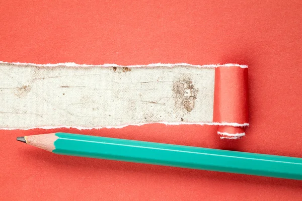 Torn red paper and pencil — Stock Photo, Image