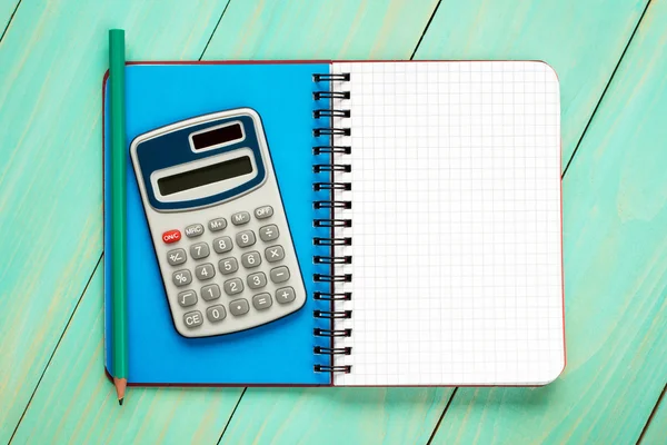 Calculator,pencil and open notebook. — Stock Photo, Image