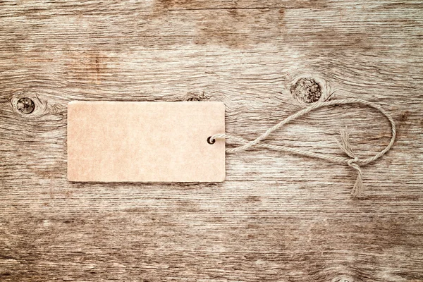 Blank tag tied with string — Stock Photo, Image