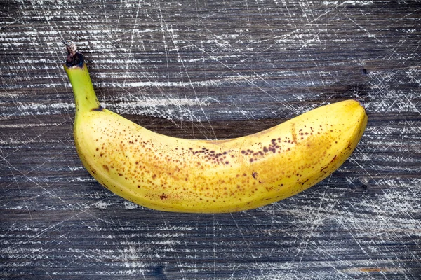 Banana on dark wooden background. — Stock Photo, Image