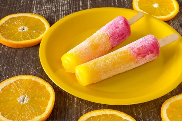 Popsicles with sliced orange fruit — Stock Photo, Image