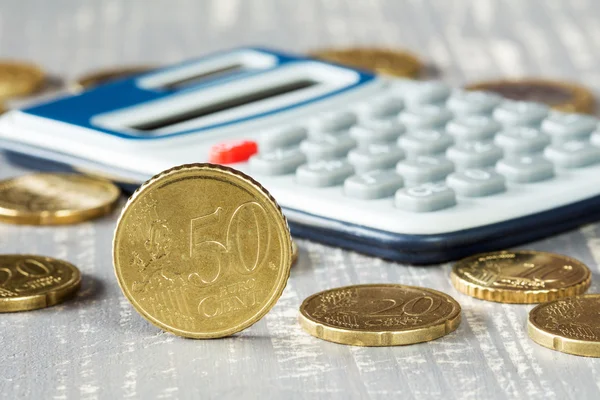 Euro coins and digital calculator. — Stock Photo, Image