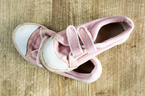 Sneakers on wooden surface — Stock Photo, Image