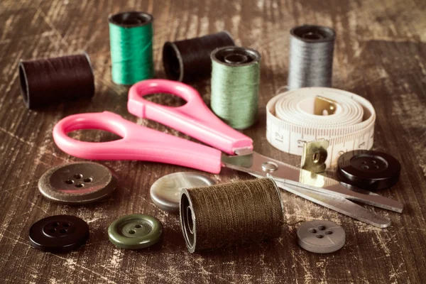 Sewing accessories on wooden table — Stock Photo, Image