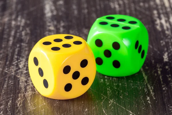 Yellow and green dices — Stock Photo, Image