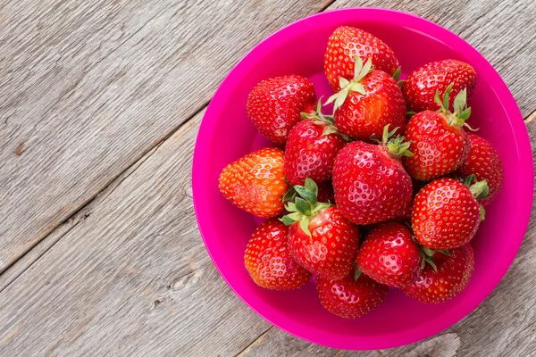 Strawberries on old wooden floor. — Stock Photo, Image