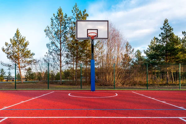 An empty basketball court found in the outdoors