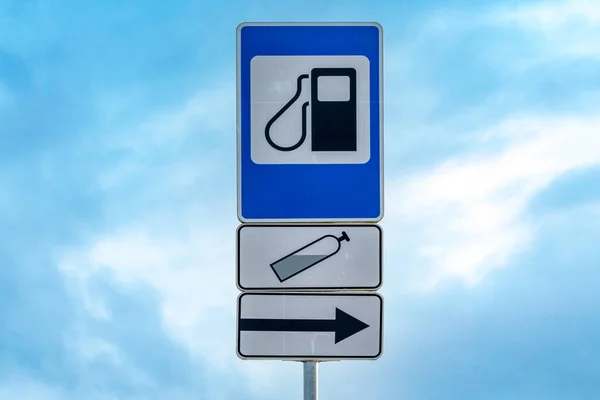 Lpg Station Road Sign Metal Pole Blue Sky — стоковое фото